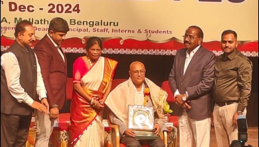 Dr. Deepak Shah receiving lifetime contribution award for homeopathy